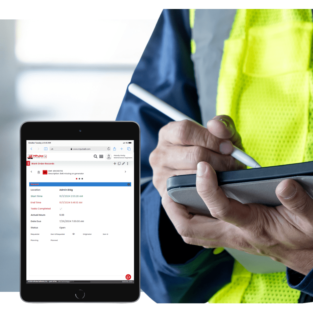 Facility technician using CMMS software on tablet to manage building maintenance tasks