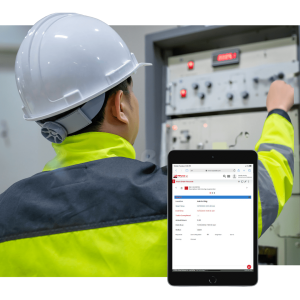 Maintenance engineer using CMMS software to document and track FRACAS reports on electrical systems