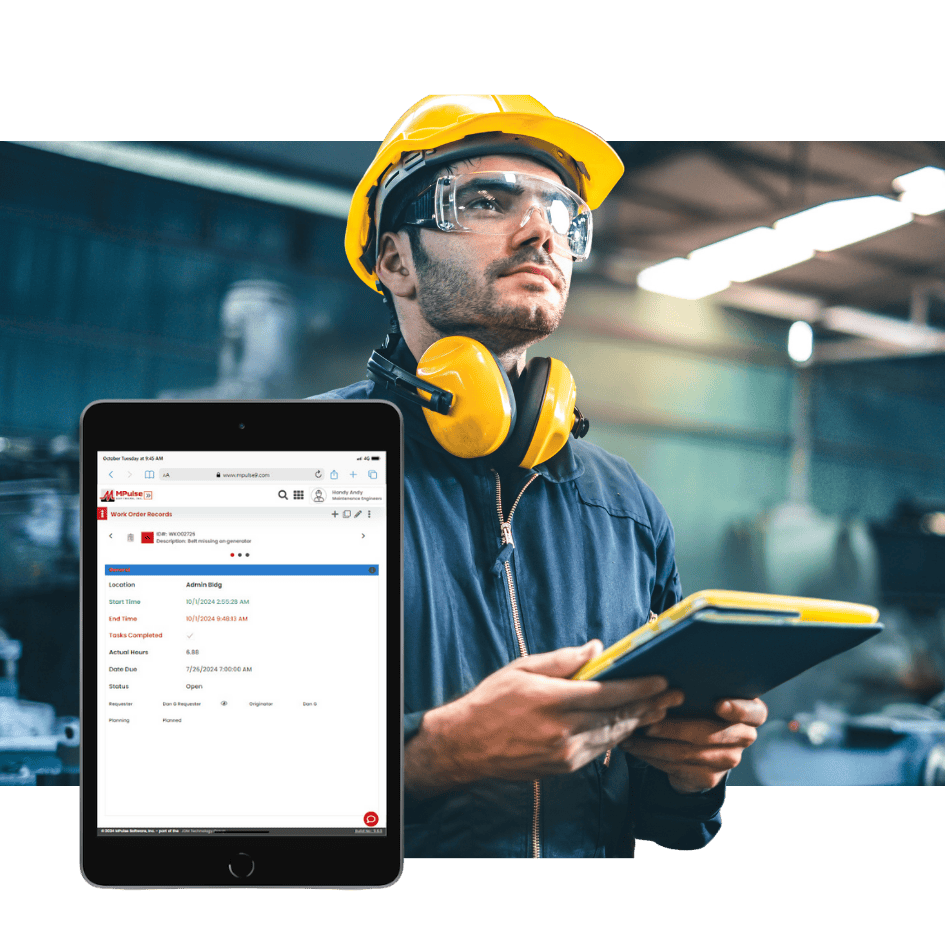 Maintenance technician using tablet with MPulse CMMS dashboard in manufacturing facility