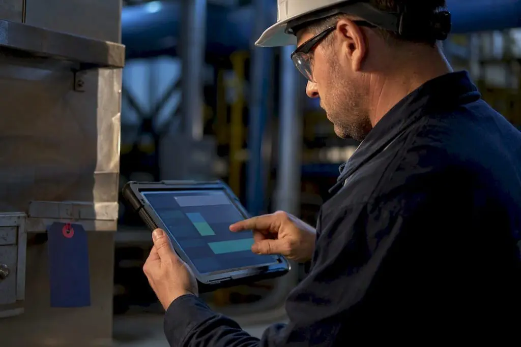 Technician recording structured maintenance failure codes
