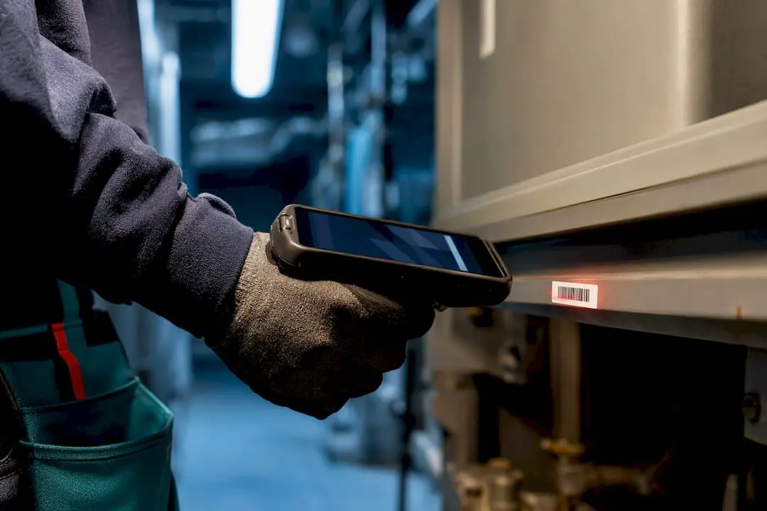 Technician scanning an asset barcode