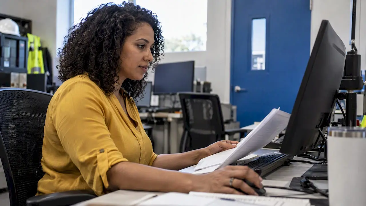 Analyst reviewing maintenance data on a monitor