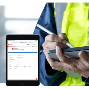 Facility technician using CMMS software on tablet to manage building maintenance tasks