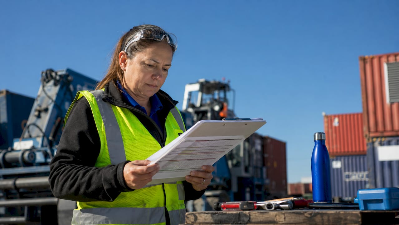 Maintenance planner reviewing workflow schedules