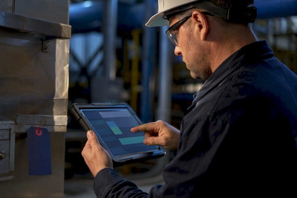 Technician recording structured maintenance failure codes